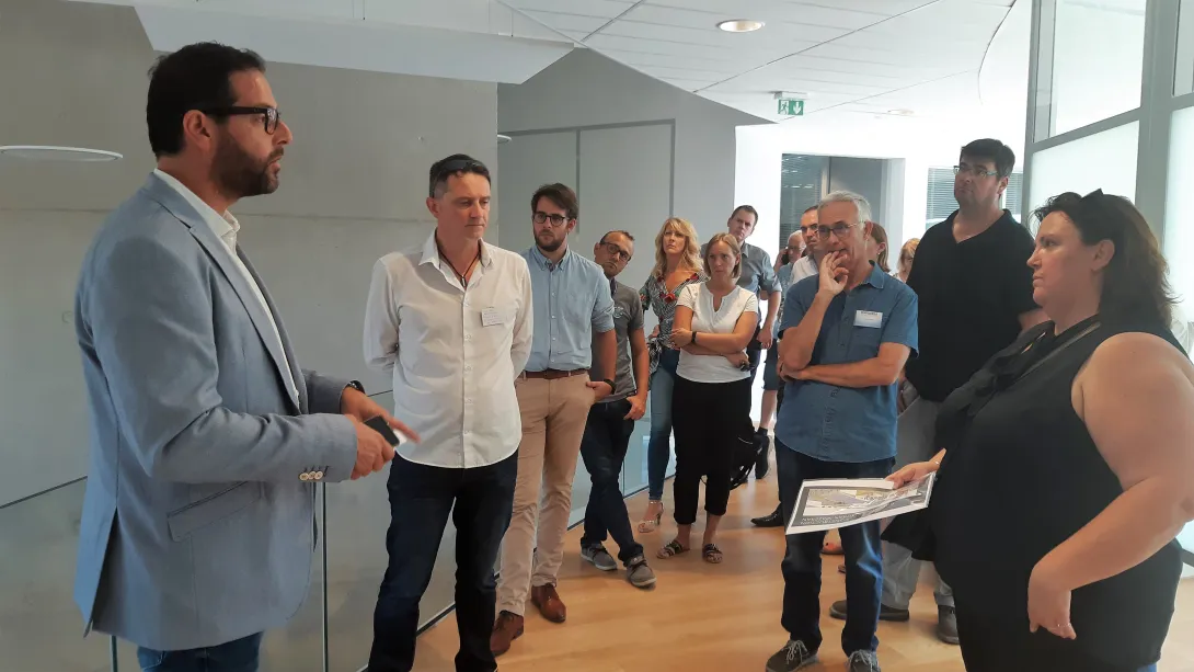 Visite du bâtiment à énergie positive de la société Quadran Energie en présence de Christine Bel, architecte